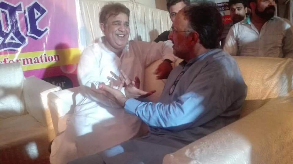 Abid Butt with Qamar Zaman Kaira on a political discussion 2017.